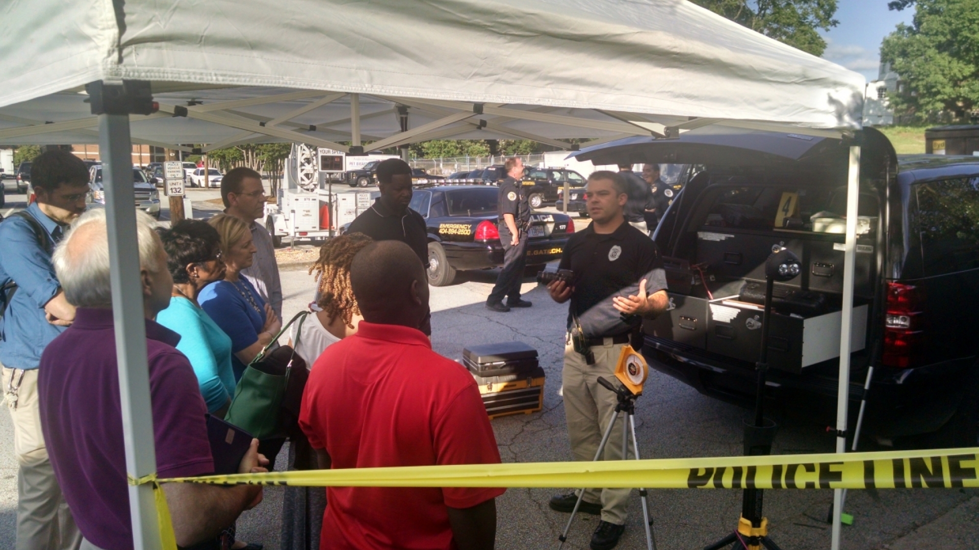 group asking question under tent